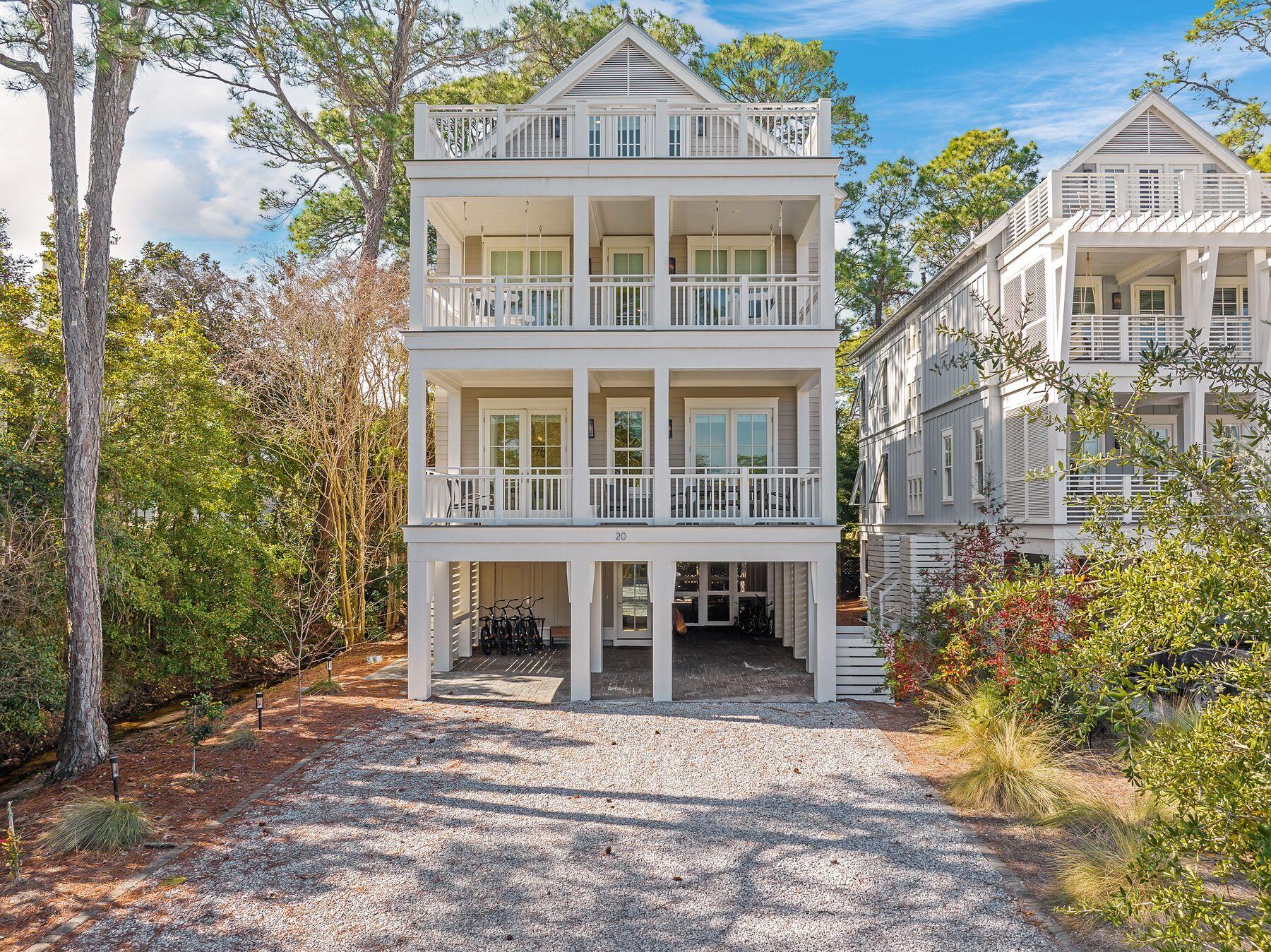 Positioned along the serene shores of Western Lake, this exceptional residence in Grayton Landing offers an unparalleled coastal lifestyle. Designed with both elegance and functionality in mind, this 3,550-square-foot home provides breathtaking lake views from every floor, a private boat slip and effortless access to the Gulf of Mexico. The second floor serves as the heart of the home, featuring an open-concept living area designed for entertaining. A chef's kitchen showcases solid wood cabinetry, quartz countertops, a Wolf 36-in. gas range and a built-in Sub-Zero refrigerator, while a covered porch extends the living space for seamless indoor-outdoor dining. The primary suite offers a custom-built walk-in closet and an en suite bath complete with dual vanity sinks, multiple showerheads and a freestanding tub. On the third floor, three additional bedrooms boast ensuite baths, including a second primary suite with a private porch and spa-inspired bath. The fourth floor is designed for entertainment and relaxation, with a sunlit bunkroom, a second living area with a wet bar and an open porch with durable Trex decking. Located within a gated enclave of just six residences, this home includes access to exclusive amenities such as a lakeside pool, outdoor kitchen, private boat dock with assigned slips and 175 feet of frontage on Western Lake. A five-minute walk leads to the gulf's pristine white sands, making this property a perfect choice for those seeking a vacation retreat or investment opportunity.
*Buyer to verify dimensions, assessment fees, and all items of importance.*