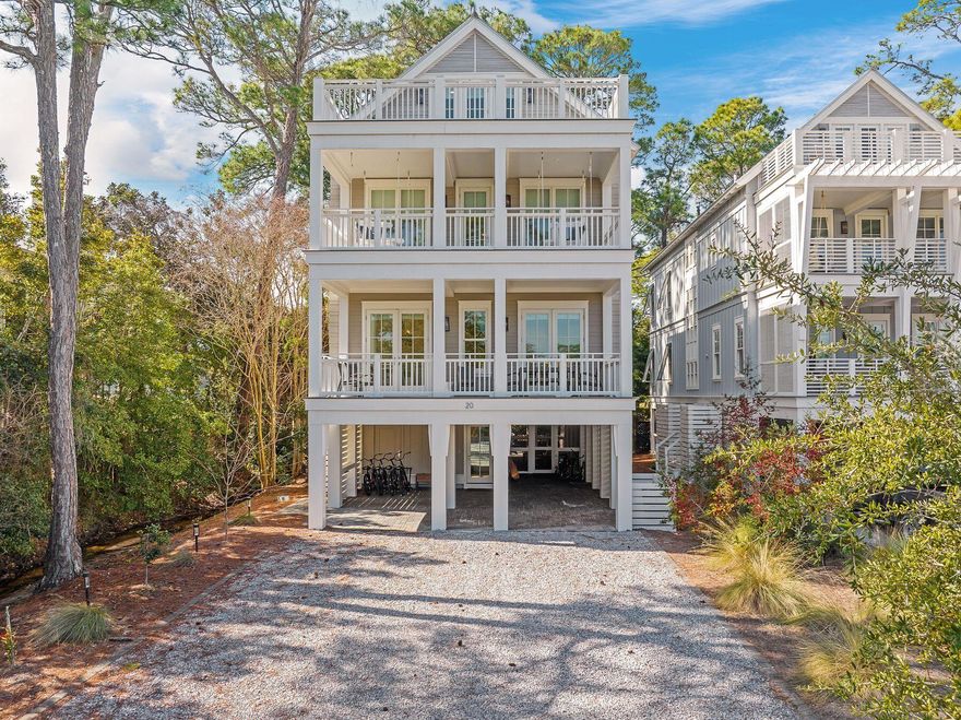 Positioned along the serene shores of Western Lake, this exceptional residence in Grayton Landing offers an unparalleled coastal lifestyle. Designed with both elegance and functionality in mind, this 3,550-square-foot home provides breathtaking lake views from every floor, a private boat slip and effortless access to the Gulf of Mexico. The second floor serves as the heart of the home, featuring an open-concept living area designed for entertaining. A chef's kitchen showcases solid wood cabinetry, quartz countertops, a Wolf 36-in. gas range and a built-in Sub-Zero refrigerator, while a covered porch extends the living space for seamless indoor-outdoor dining. The primary suite offers a custom-built walk-in closet and an en suite bath complete with dual vanity sinks, multiple showerheads and a freestanding tub. On the third floor, three additional bedrooms boast ensuite baths, including a second primary suite with a private porch and spa-inspired bath. The fourth floor is designed for entertainment and relaxation, with a sunlit bunkroom, a second living area with a wet bar and an open porch with durable Trex decking. Located within a gated enclave of just six residences, this home includes access to exclusive amenities such as a lakeside pool, outdoor kitchen, private boat dock with assigned slips and 175 feet of frontage on Western Lake. A five-minute walk leads to the gulf's pristine white sands, making this property a perfect choice for those seeking a vacation retreat or investment opportunity.
*Buyer to verify dimensions, assessment fees, and all items of importance.*