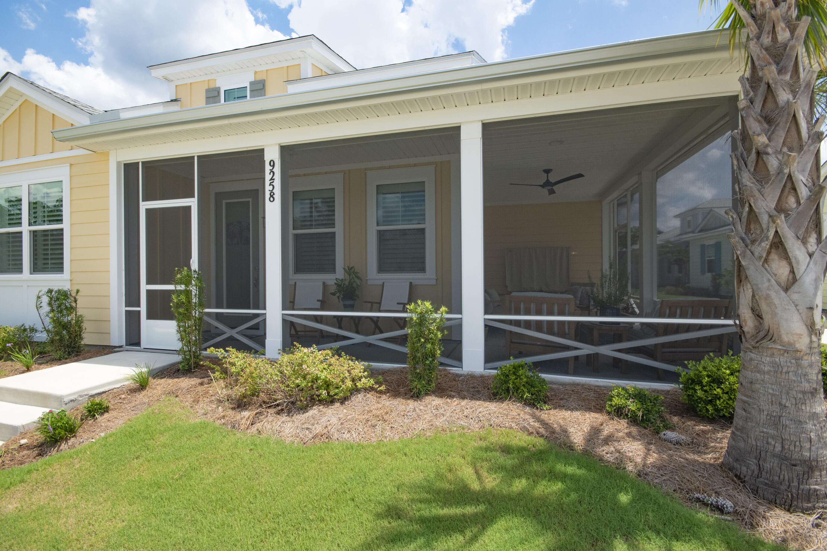 TURN-KEY. Buy it Furnished or without furniture, multiple options! Live the Margaritaville lifestyle at 9258 Cool Breeze Drive in Latitude Margaritaville at Watersound, a 55+ gated, resort-style community only 7 miles from the beaches. Welcome to your fully furnished Dreamsicle Cottage that sits on a desirable street-side lot in Phase 6A, one of the smallest phases where you have wonderful neighbors and no thru traffic. Step inside the coastal dreamlike cottage to find many extras from the custom plantation shutters on every window to the gourmet kitchen with all KitchenAid appliances (counter depth refrigerator, quietest dishwasher, gas range, & 600 CFM recirculating range hood), quartz countertops, 42" stained level II cabinetry w/crown molding, dovetail drawers and soft close drawers & doors and extended refrigerator cabinet w/panel. The upgraded custom lighting in the kitchen, dining area and foyer enhances the elegance of the cottage. The master bath is an oasis with its tiled shower with seamless shower door, quartz countertops, beautiful mirrors, level 4 tile floors, and cabinets over the toilet for added storage. The updated Mohawk RevWood flooring flows throughout the house. The laundry room is equipped with Whirlpool washer/dryer and cabinets for extra storage. Your guest will enjoy the bath that has tile walls, a beautiful glass tub enclosure, tile flooring and quartz countertops. Enjoy morning coffee or afternoon sunset views on the screen enclosed lanai. The garage boasts Xylene floor coating, a mop sink, Gladiator shelves, FastTrack steel multipurpose storage rail systems, 2 20 amp golf cart outlets and a smart garage door opener. THIS HOME IS LOADED! The balance of a 2 year Master Care Warranty from the original build/close date and a 10 year structural warranty is included. The HOA provides lawn care, exterior paint and roof replacement (on a schedule) and Fins Up! Gym access (excludes select classes). Unmatched amenities: Latitude Town Square with bandshell for live music/events, Bar & Chill restaurant and Overlook Bar, resort style pool overlooking the Intracoastal Waterway and tiki huts, Fins Up! Fitness Center, pickleball, tennis, and bocce ball courts, Barkaritaville Dog Park, Port of Indecision kayak launch, Workin' N' Playin' Center. All connected by walking trails, sidewalks and golf cart friendly streets. Located near medical, shopping, 30A, and ECP Airport. Come see this move-in-ready gem today!
