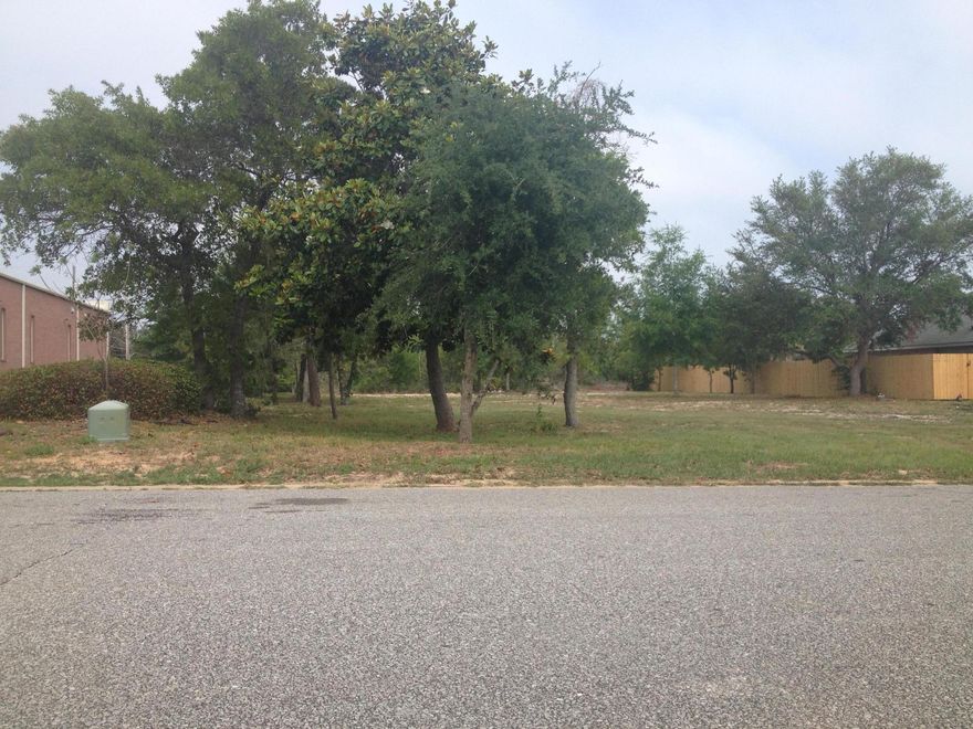 HUGE CLEARED LOT....90' x 180'....No hoa dues....High & Dry - No flood insurance required....Privacy of no neighbors to the left and none to the rear...EZ access from/to Hwy 98 with cut in median for left turns....Walking distance down to the Intercoastal (4 short blocks away)....Quiet area but yet so close to amenities like shopping, schools, beaches, Lowes, Wal-Mart, etc....Utilities are underground....To build a new home it will require tap-in to main sewer....Nice homes in subdivision - no mobile homes allowed....A great opportunity to build your new home on this spacious semi-private large lot with quick access to the main hwy and so convenient to amenities and outdoor entertainment like fishing, boating, beach going .... Please click on photo tab for more...