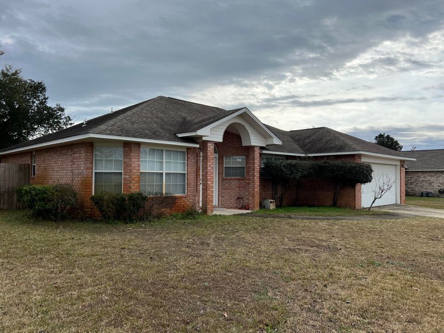 Great investment opportunity and great location! Come to the water access neighborhood of Sandy Beach Estates! Subdivision in East Navarre close to Hurlburt base, beaches, and restaurants! This home is the popular Bimini II floor plan; Home features a 12 x 14 covered Patio as an extra feature; Split floor plan includes 3 bedroom 2 bath home; Home  features a nice fireplace and is a great starter home or a great investment opportunity; Public sewer is a plus too! Open floor plan with kitchen open to the Living Area; Kitchen has large Island for entertaining and family gatherings! 2015;  formal dining room could also be used as a home office, den, or playroom for the kids; Home needs some TLC but could be a great investment in this great location; Roof is 2014; AC 2020 and Water Heater 2015