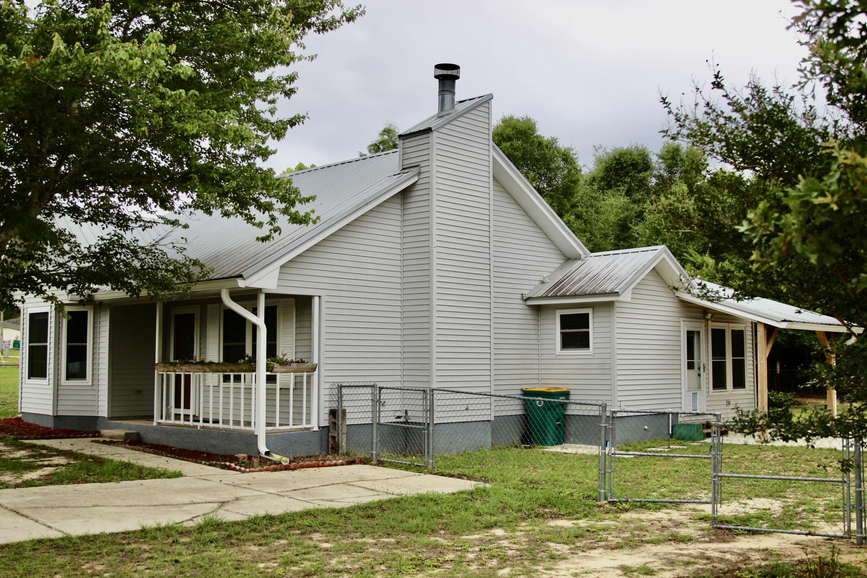 Here is a traditional home with 2 beds 1 bath right at 1,150 Sq. Ft. This home has a large bonus room. The kitchen was recently updated a new storage shed. All on 0.75 Acre fully fenced lot. The septic has been pumped, the fireplace has been inspected and cleaned. New flooring in the laundry room.
