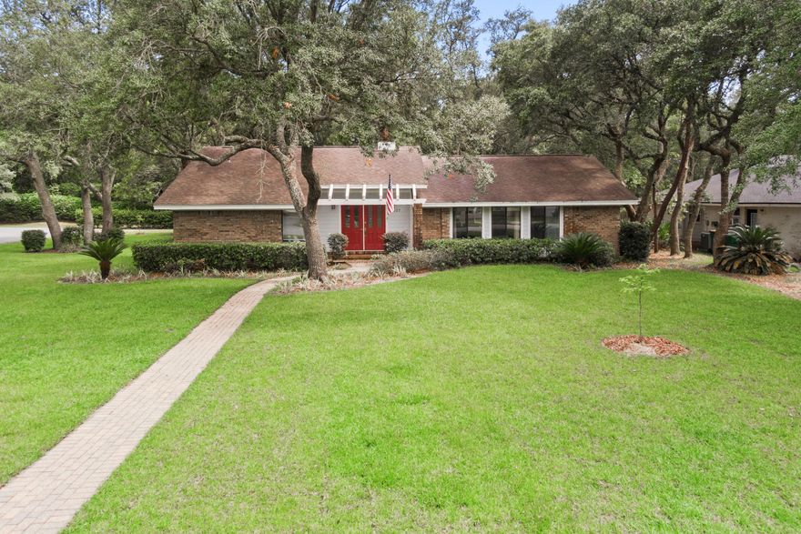 Nestled on a spacious 1/3-acre corner lot backing to a peaceful greenbelt, this home offers privacy, flexibility, and an unbeatable lifestyle -- all with no HOA! Located in the highly desirable Bluewater Bay community, featuring a golf course, pools, tennis center, marina, restaurants, and miles of walking trails -- all just minutes from top-rated schools, military bases, and the world's most beautiful sugar white sand beaches in Destin.Inside, the home features a double-sided fireplace, tile and wood floors, and a spacious primary suite with a sunken tub and open shower. The kitchen offers granite countertops, oak cabinetry, and a breakfast bar -- perfect for both everyday living and entertaining.As an added bonus, the seller is offering an $11,000 credit toward a master bathroom remodel, or will complete the renovation prior to closing for a seamless move-in experience.
Step into the backyard retreat, shaded by mature oak trees, where you'll find a built-in fire pit - the ideal space for relaxing or gathering with friends and family. The expansive lot also offers ample space for boat or RV parking, if desired.
Recent upgrades include new sod, a full irrigation system, exterior lighting, and a brand-new water heater - providing peace of mind and excellent curb appeal.
Whether you're looking for a beautiful primary residence or a strong long-term rental investment, this property truly checks all the boxes.
