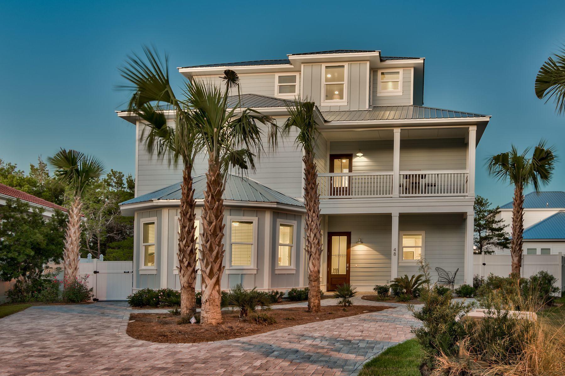 Discover this newly constructed coastal contemporary retreat prominently located in the gated beachside neighborhood of Emerald Waters Village. Boasting six bedrooms and an impressive amenity package including a private resort style pool, 48 St. Nicholas Court is a well-appointed and carefully crafted house that seamlessly combines coastal charm and modern beauty. Upon entering, you are greeted by a spacious open floor plan with soaring 10' ceilings. The chef 's kitchen is oversized and well appointed offering stainless steel appliances throughout and ample cabinet space. Adjacent to the kitchen, the sizable dining room table can comfortably seat up to twelve guests.