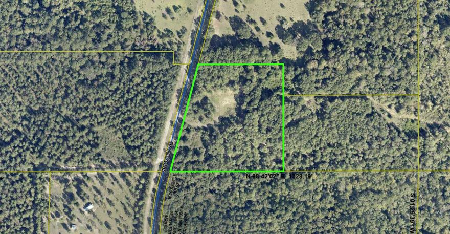 Beautiful 7-acre parcel on Knox Hill Rd with over 600 feet of road frontage and a partially cleared area already in place. About 1/2 acre is cleared in the center of the property, offering an ideal spot for a private home site. Natural wooded borders along both the north and south sides provide excellent privacy while still allowing room to build and enjoy the land. A great opportunity for anyone looking for space, seclusion, and a true Florida country setting.