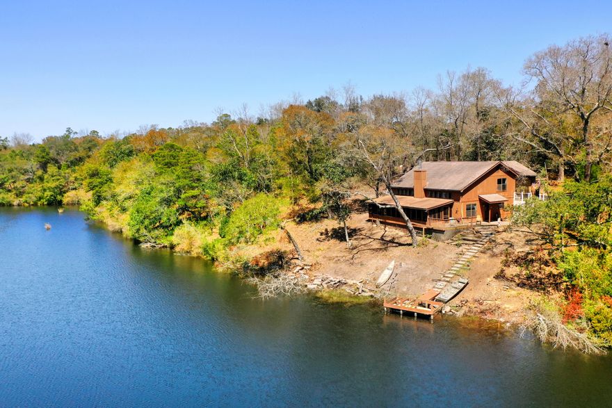 LAKEFRONT OPPORTUNITY | AS-IS SALE | PRIME LOT ON LAKE SHARONThis is your chance to reimagine lakefront living in one of Freeport's most serene and secluded neighborhoods. Tucked away at the end of a quiet cul-de-sac in Lake Sharon Estates, this 3-bedroom, 2.5-bath home offers sweeping views of the water and sits high and dry on nearly half an acre (.44 acres) of private, wooded land.With some TLC, this home has amazing potential with location, setting, and view. You'll have direct access to the lake - the lot itself is one of the finest on Lake Sharon. Whether you envision a modern lakeside retreat or a rustic waterfront getaway, this property is a blank canvas ready for your vision. Build your ideal retreat on the lake and minutes from the bay