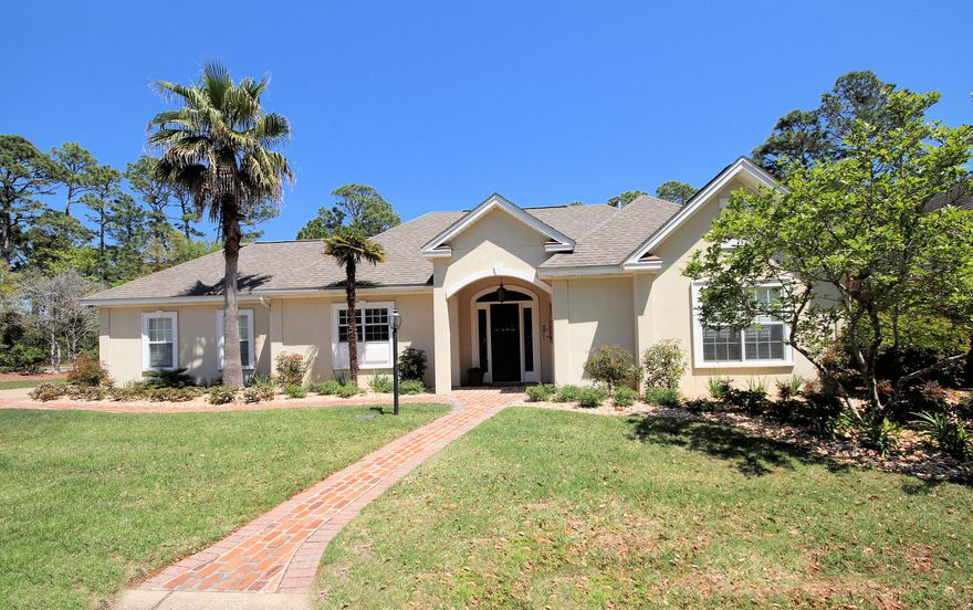 Gorgeous single-story home with TONS of upgrades that has been impeccably maintained over the years with only two owners.  This home is tucked away on a large corner lot at the end of a cul-de-sac in the private community of Oakmont Place in Bluewater Bay. You will love everything about this two-bedroom, two-bath home that simply has it all, including many extra touches! You immediately feel the warmth and coziness of this home as you enter through the impressive Antique Cypress door with beveled glass. Live large with this wonderful open floor plan with a beautiful sunroom addition off the back. You will settle right into the indoor/outdoor living that this home has to offer. High ceilings, hardwood flooring, gas fireplace, cathedral ceiling in living room, crown molding,