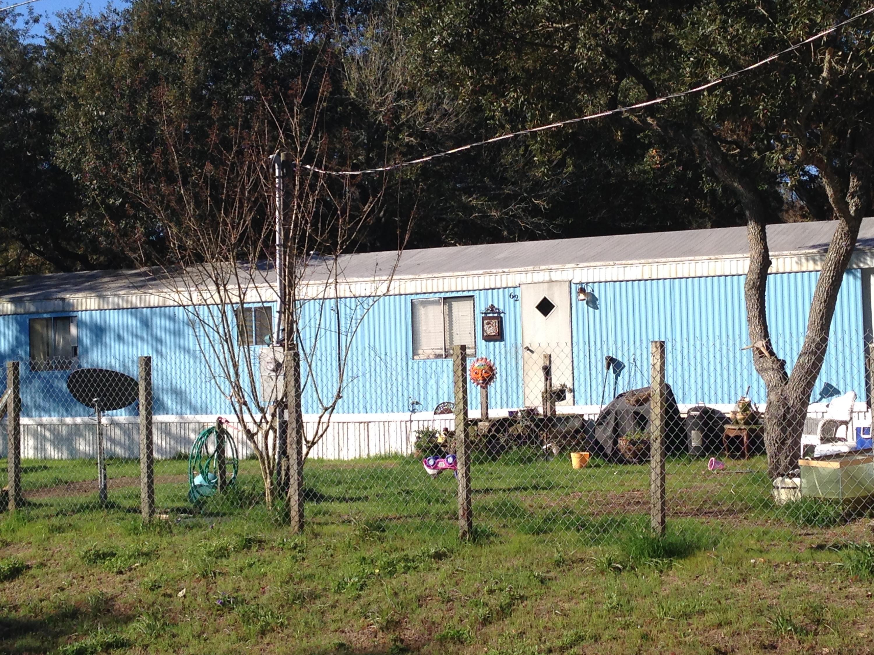 2 Bedroom, 2 Bath Mobile home situated on a corner lot. This lot can be accessed from either street. Great property to use as a rental. Stove & refrigerator does not convey. This property will be sold as-is.