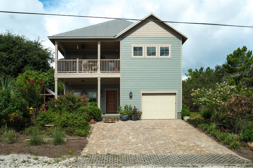 This immaculate two story craftsman home has great views of the Gulf from the living areas. Built to exceed state building and wind codes as a high-end builder's personal home, including an elevator, a whole house generator, and a gas tank-less hot water heater. The lower level is about 21' above sea level, in an X Zone. Large Gulf facing porches at both levels with a breeze almost every day. This home has high end finish, with solid white oak floors, cypress ceilings, and cypress ship-lap walls in the main living areas. Lots of built-ins, with craftsman style wood trimmed windows throughout. Gourmet kitchen with custom solid wood cabinets, 5 burner 2 oven stainless 42'' gas stove, stainless refrigerator and dishwasher, 2 sinks, granite countertops. Less than 1000' to beach!!!!!