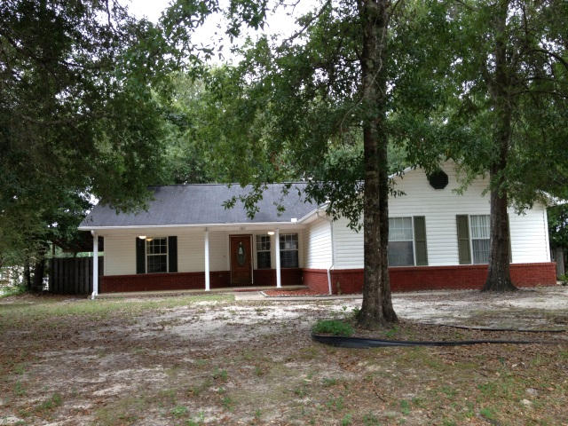 This low-maintenance vinyl-sided home is located near the center of Crestview on a level corner lot. Brick accents add a touch of elegance. The large covered front porch has two ceiling fans. The backyard is fully privacy fenced and offers a partially covered back deck and fully finished heated/cooled Florida room with tile flooring, great for cookouts. The garage has been converted into a large room with brand-new carpet, walk-in closet, French doors, and built-in storage that could function as a home office, playroom, den, or a bedroom. The conversion is the only room with carpet; all other rooms feature laminate wood or tile flooring. This home was made for entertaining as the kitchen, living room, and dining area are all open to one another. This one must be seen to be appreciated.