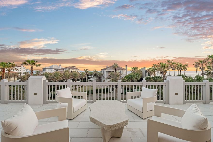 Designed by Byron K. Smith and built by Alys Beach Construction, with interiors by James Design, this thoughtfully furnished corner-lot residence offers an expansive floor plan with 4+ bedrooms plus a bunk room and 6.5 baths, spanning over 5,300+ square feet of heated and cooled space. A 400-square-foot rooftop terrace, accessed through a 5-panel Nano door, provides breathtaking panoramic gulf views. This seamless indoor-outdoor transition creates an ideal layout for entertaining while taking in the beauty of 30A sunsets. Built with fortified concrete construction, the home offers both durability and sophistication, blending timeless architecture with modern luxury. The first-floor exterior features a private entry courtyard with tranquil water features, leading to the Zaguan area, an outdoor oasis complete with an expansive pool, spa, outdoor kitchen, and large fireplace, designed for year-round enjoyment. Inside, White stone pavers flow through the first floor with sandbar-stained oak flooring on the second and third floor, complementing expansive tray ceilings with pecky cypress beams and Venetian plaster walls. The kitchen is a chef's dream, featuring an oversized island, WOLF/Sub-Zero appliances, a Wolf coffee maker, and a separate wet bar with a wine fridge, beverage cooler, and ice machine. A walk-in pantry, laundry room, and custom Ashley Norton door hardware complete this level. The Zaguan back entrance offers custom wood screens, shutters, ample storage, and a drop zone for all your beach essentials. The second floor is designed for privacy and luxury, featuring a grand primary suite with a private study, Venetian plaster ceiling, and an exterior loggia porch. Wake up to serene gulf views from the king-sized bed, while the primary bath boasts a double vanity, custom linen cabinet, steam shower with dual shower heads, and an expansive walk-in closet. The Jr. primary suite features an en-suite bath and private balcony overlooking the loggia and pool. A bunk room includes two sets of full-over-queen bunk beds with its own en-suite bath, while two additional guest suites, each with private baths, provide ample accommodations. A second-floor laundry room adds convenience. The third floor is an entertainer's retreat, boasting an elegant cypress wood ceiling, a wet bar with a beverage cooler and ice machine, and a full bath with a walk-in shower and double vanities. Step onto the covered terrace or the expansive rooftop terrace, where panoramic gulf views set the perfect backdrop for relaxation or entertaining. A two-car garage with the ability to accommodate a double car lift completes this exceptional home. Perfectly situated in the heart of Alys Beach, this extraordinary residence offers a rare opportunity to experience the pinnacle of coastal luxury. Inquire today to learn more.