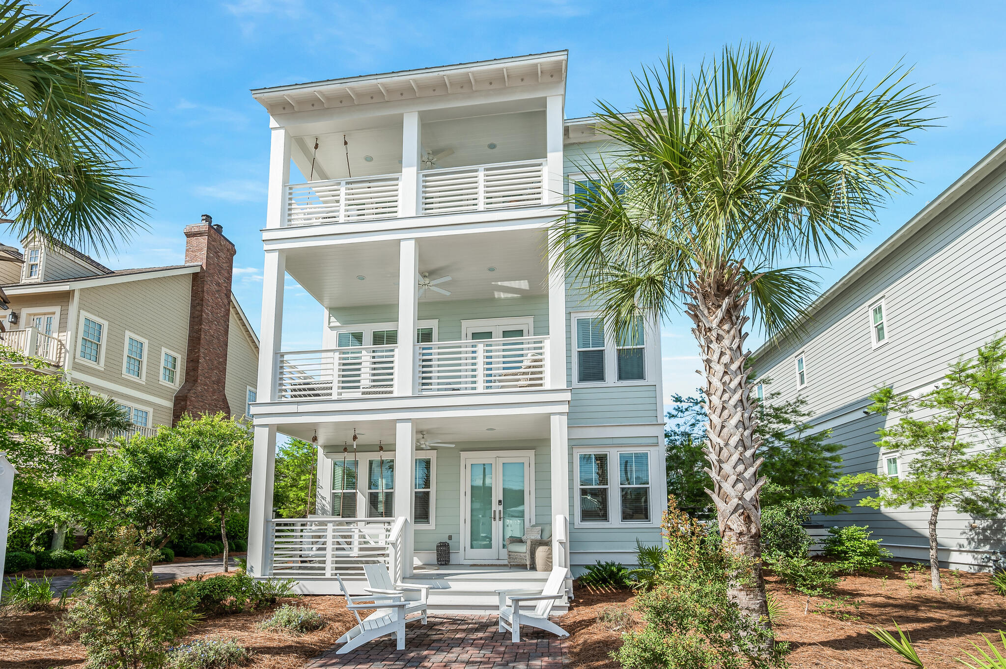 Welcome to an extraordinary coastal haven in the heart of Prominence South, where luxury and comfort merge to create the ideal beach retreat. This beautifully furnished, five-bedroom, three-and-a-half-bathroom home is rental-ready with annual rental revenue being over $165k per year for the past 4 years. Complete with an elevator, a garage and a golf cart, this residence is designed to accommodate up to 20 guests, making it perfect for large families or savvy investors. As you arrive, a charming brick paver driveway and walkway guide you to the entrance. Inside, hardwood floors stretch throughout the spacious main living areas. The first floor boasts a massive master suite with a private porch and sitting area, offering a serene escape. A custom-built bunk room with an entertainment space provides the ultimate hangout for kids of all ages.
The second floor is an entertainer's delight, featuring a vast open-plan living area that effortlessly flows into a gourmet kitchen with premium cabinetry, a gas cooktop, a convection oven and modern appliances. A walk-in pantry, powder room, laundry room and a large covered porch complete this level, offering ample space for gatherings.
The third floor houses two guest bedrooms that share a bath and a second master suite with its own sitting area and expansive private porch, perfect for unwinding after a day at the beach. Built for durability and convenience, this home features HardiPlank siding, a metal roof and impact-resistant windows. It also includes a complete smart home tech package with automated systems for lighting, climate control and keyless entry. With its impeccable design, modern conveniences, and prime location near the beach and community amenities, this Prominence South gem is the ultimate investment or vacation retreat on 30A.