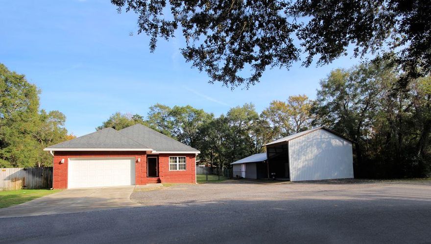 Looking for a newer house in the Niceville area on a .34 acre corner lot with a workshop/office/RV and boat storage building as well? Look no further, you have found it! This unique property in Villa Tasso isn't governed by covenants that will restrict your use. Live in the wonderful 3/2 all brick home and utilize the extra building as an office for your home business or additional storage or gym or anything else you need AND have covered parking for an RV and a boat. There are 4 separate office spaces and a half bath in the building (heated and cooled with a window unit) so you can use this space year-round. The 2009 built home features an open floorplan and also has a 476sf heated and cooled bonus room and half bath over the garage with a private entry! There is a screened porch in the back of the house, the lot is fully fenced and there is a sprinkler system as well. Don't miss out on this unique property! Total SF includes the 1715sf home + 476sf bonus room but NOT the office space.