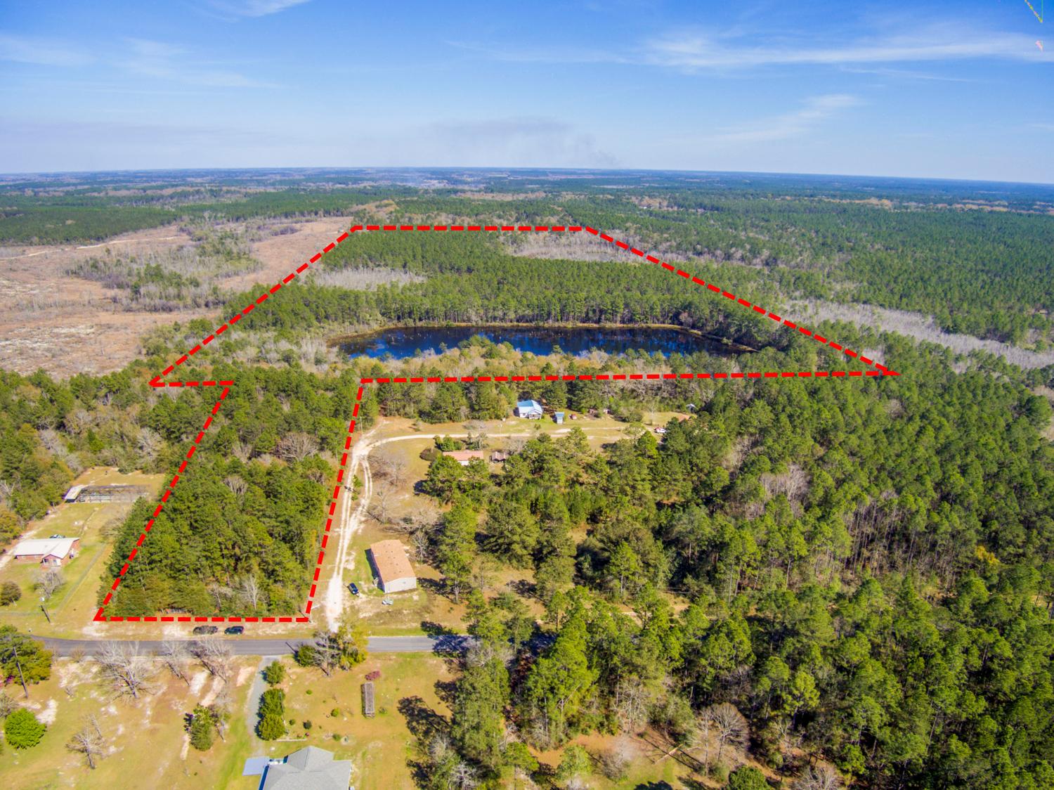 82.50 ACRES Hunter's Delight and Fishing on your PRIVATE 10 Acre Lake! Plus a Duck Pond, Creek Crossing with walking bridge and Feed Plot. Enjoy peace and quite and bring your recreational vehicles to roam the land. Perfect weekend getaway to Camp! OR build your home or weekend cabin! The current owner's put in a drive on the 2.3 Acre parcel on Four Flags to the adjoining parcel of 80+ Acres. Also added a Cabana complete with electrical hookups that can be powered by a generator, outdoor storage area, outhouse, created trails through the acreage, added a crossing bridge over the creek and a feed plot. SURVEY available with the two parcels combined. Some corners are flagged. If you want to bring in electric the line has been cleared for Chelco and may need some trimming. Schedule a TOUR!