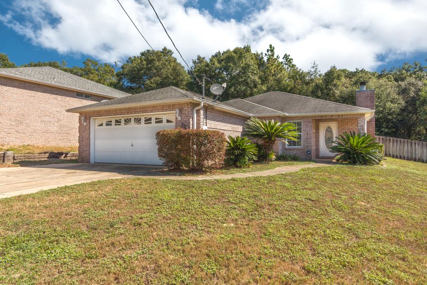 Under $200k and South of I-10. This brick home is convenient to schools, military bases and the beaches. Open floor plan with wood-burning fireplace. Stainless steel appliances. Large master bath/with walk-in closet. 17x17 tile floors and wood laminate flooring master bedroom. Brand new HVAC. Large private rear yard with 20 x 10 patio and oversized driveway.