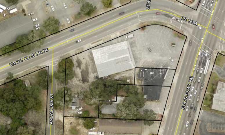Income Producing Corner lot.  This is 3 parcels in total being sold together for a total of 1.68 acres.  Multiple Business spaces and 3 homes are included.  Call Listing Agent Justin Myers @ 850-685-6481 for more information.
