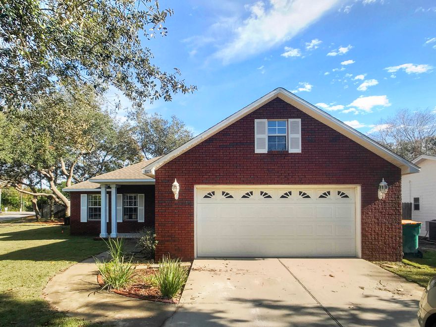 Big corner lot in the heart of Destin, Beautiful red brick home within walking distance to Main Street Waterfront Park. Lots of upgrades including New granite in the kitchen as well as new wood floors in the living room. Move in ready! New Stove and dishwasher and a big Island in the kitchen opens up to the dining room and the living room. Living room and dining room have Tray ceiling and crown molding through out . The master bedroom has recessed lights plus a nice size walk in closet. The Master bath has a double vanity and a separate shower, Bedrooms are all carpeted. Outside the home is situated on a Oak tree shaded lot, landscaped and sodded with new Zoysia grass. Double car garage plus sidewalks in the neighborhood !