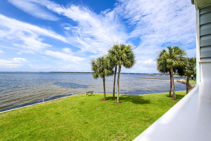 It's all about the VIEW! Are you longing for 180 degrees of unobstructed BIG WATER views framed by tropical palm trees and expansive lush lawns? Welcome to Finisterra, a gated waterfront community complete with pool, clubhouse, on-site laundry, kayak racks and tennis court. This 2nd floor unit is unique with a windowed two story foyer. Beyond the foyer and living room are breathtaking views of Choctawhatchee Bay. It's like stepping onto a cruise ship! Enjoy drinks on the covered balcony while watching herons stroll the grounds and dolphins cruise the bay. Easy living with a priceless view! New HVAC.