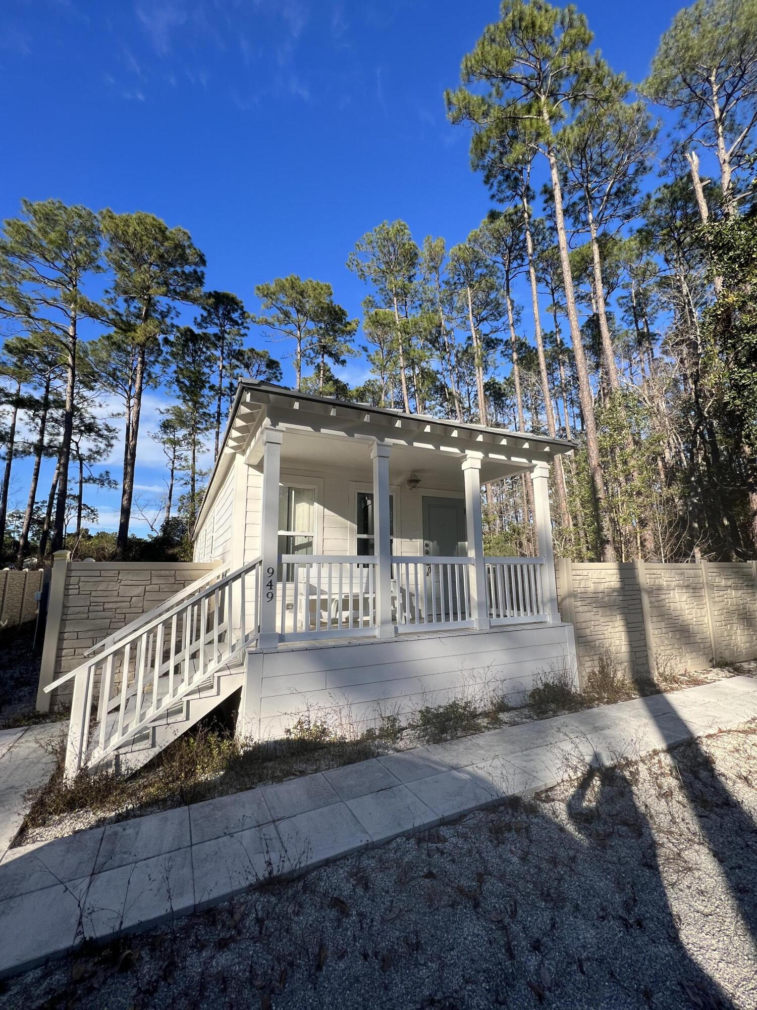 Incredible Opportunity on purchasing this Home AND 2 adjoining Buildable Lots in the highly desirable Point Washington area!This Bulk sale of 3 parcels includes a 'Katrina Home' offering all kinds of possibilities! It is a coastal white exterior/interior color palate, metal roof, all hard surface flooring, White kitchen, Stainless appliances & custom built interior window shutters! A 2nd bath has been added to the 2nd bedroom. The Home includes a brand new high-end LG Washer/ Dryer full-size combo unit! It is being sold AS-IS and ready for a new owner to do their minimum updates making it perfect for a Primary, Secondary or short-term Rental! There is plenty of parking! A solid faux stone/ highly durable fencing surrounds most of the house lot,