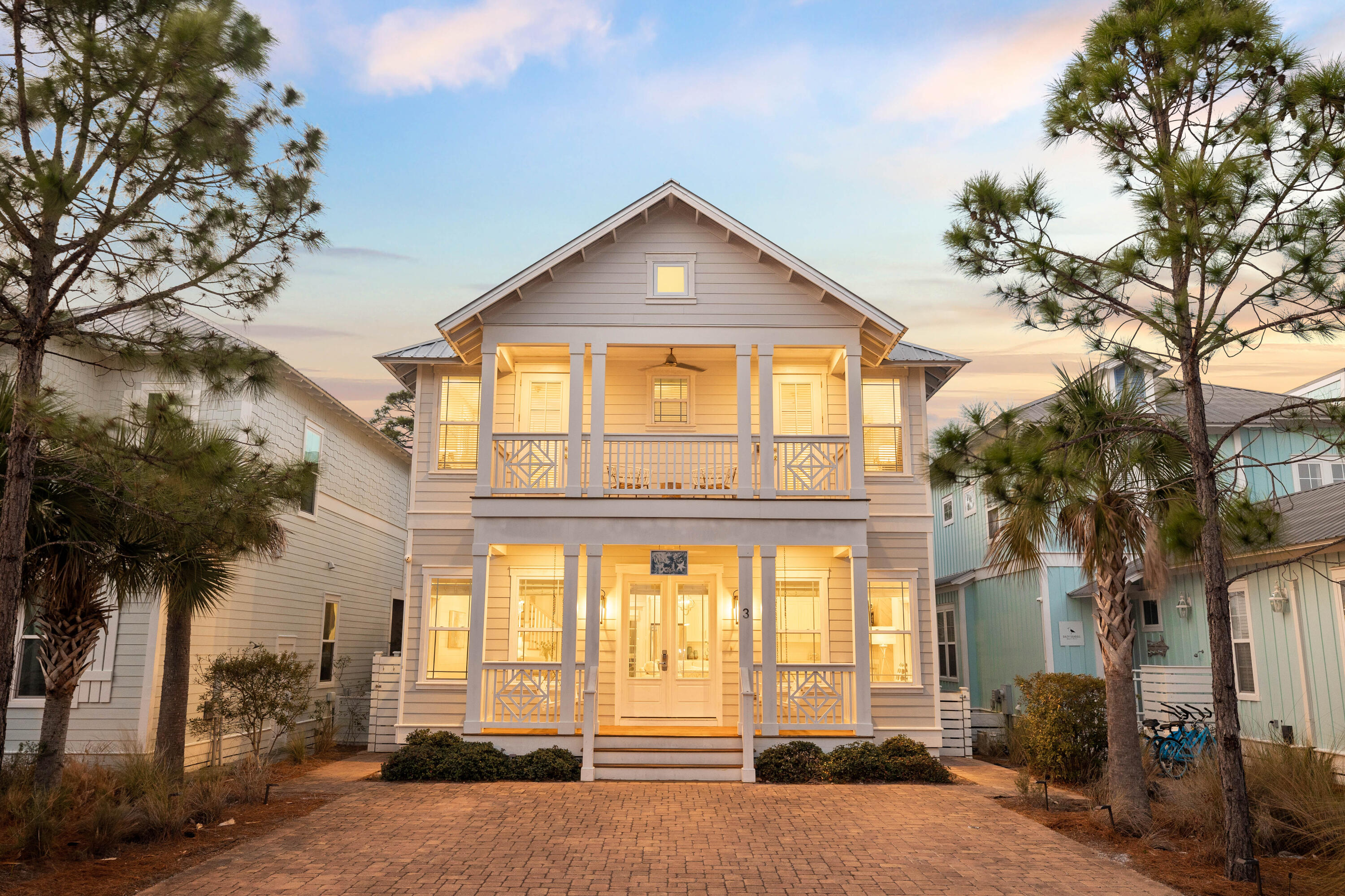 Step into Walk on The Beach, an exquisite 5-bedroom, 4.5-bathroom retreat nestled in the heart of Seacrest Beach. Completed in 2020, this thoughtfully designed sanctuary exudes warmth and sophistication, making it the perfect escape for multi-generational gatherings, a private coastal haven, or a lucrative investment opportunity.Through grand French doors, you're welcomed into an expansive open-concept living space, where rich warm wood flooring and elegant brass finishes add a touch of timeless luxury. A cozy gas fireplace anchors the inviting living area, while the refined dining space and state-of-the-art kitchen flow seamlessly together. The gourmet kitchen is a chef's dream, featuring an oversized island, a gas cooktop, and premium appliancesall designed to make entertaining effortless. Sunlight spills across the room, illuminating the entire width of the home, creating a warm and inviting ambiance for gathering and unwinding.

Venture upstairs to discover a spacious loft, complete with a sleeper sofa, offering a secluded retreat for relaxation. The custom bunk roomdesigned to sleep sixmakes for an ideal haven for families and guests alike. Two beautifully appointed primary suites provide luxurious comfort, each offering a private oasis with spa-like bathrooms and serene, light-filled spaces. Thoughtfully designed bedrooms and elegant bathrooms ensure that every guest enjoys a retreat of their own.

Outdoor living is just as impressive, with expansive porches that extend the living space into the fresh coastal air. A screened-in porch provides the perfect spot to relax year-round, while the dedicated grilling area invites al fresco dining and entertaining after a day at the beach.

Positioned perfectly along 30A, this home offers effortless access to the best of coastal living. Stroll or bike to the world-class dining, shopping, and iconic white sands of Alys Beach and Rosemary Beach, just moments away.
