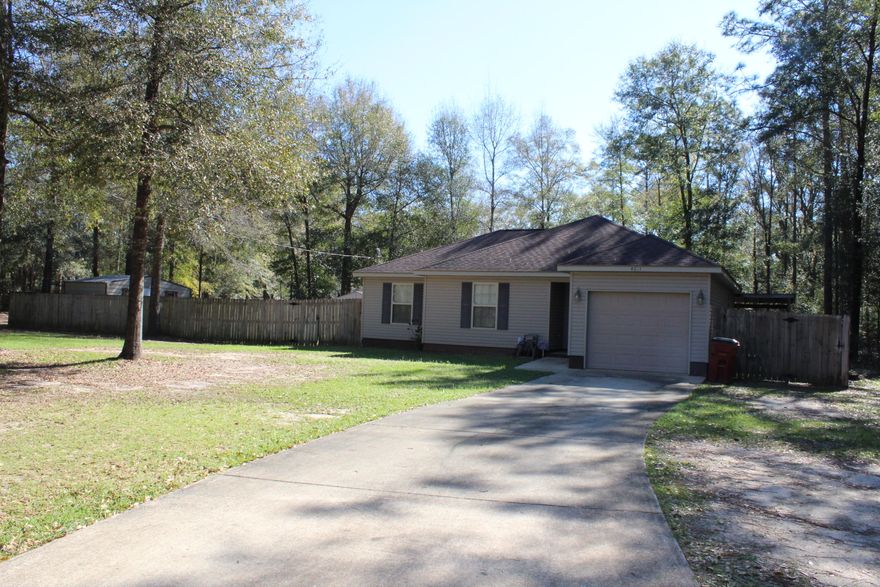 Cute 3 bedroom, 2 bath home in Holt! All tile and laminate flooring, no carpet! Large fenced back yard and covered porch to spend your summer evenings. Quiet neighborhood, just minutes from I-10! Two yard sheds for storage will convey. Buyer to verify all information deemed important.