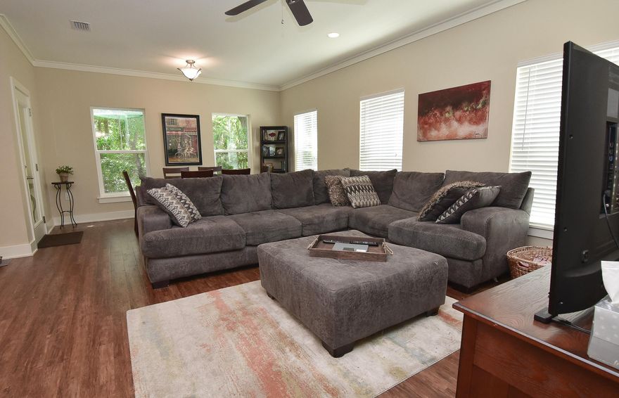 Almost new, this home is open, airy and cozy, from the moment you walk in the door. The beautiful hardwood floors shine and the wide entryway beckons you on in. The living room is large enough for even the biggest sectional and is open to the dining room and kitchen. The kitchen has a great island to work on, beautiful granite and gorgeous dark cabinets, giving the home a luxurious feel. The back of this home is nestled in the trees, which can easily be seen throughout the home thanks to the many windows across the back. Secluded in nature, it gives you the feeling of being in a treehouse, especially when you are enjoying the large covered porch and gazing out at your own private sanctuary. The kids will have a ball making forts and playing in the steam in the low maintenance natural yard. Upstairs,the laundry is handy in the hallway, and the two guest bedrooms share a nice sized full bath. The master has a large walk in closet and the master bath is beautiful with a big tiled walk in shower and a oversized tub for relaxing at the end of the day.
This is a home that you dont want to miss!