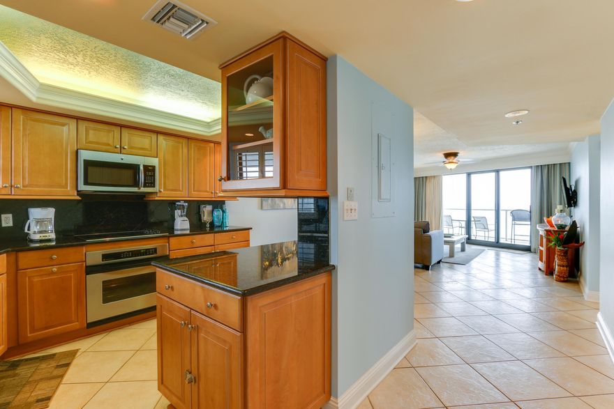 Upon entering, WOW is what you will say! This floor plan offers expansive Gulf views from the open kitchen, dining & living areas plus the beachfront bedroom. Check out the kitchen with its abundance of light maple cabinets, granite counters, modern stainless appliances, recess lighting and coffered ceiling with hidden lighting plus a wall cabinet Island! The Dining area is great for playing games. watching the cooks in the kitchen or TV or the Gulf of Mexico. The sleeper sofa in the Living area is great to relax after a day at the beach or watch a great sunset on the balcony or have a night cape and listen to the waves! Also great views from the master suite. Keep this to your self or let family or friends come to enjoy or do vacation rentals with 36-45k rental potentials .