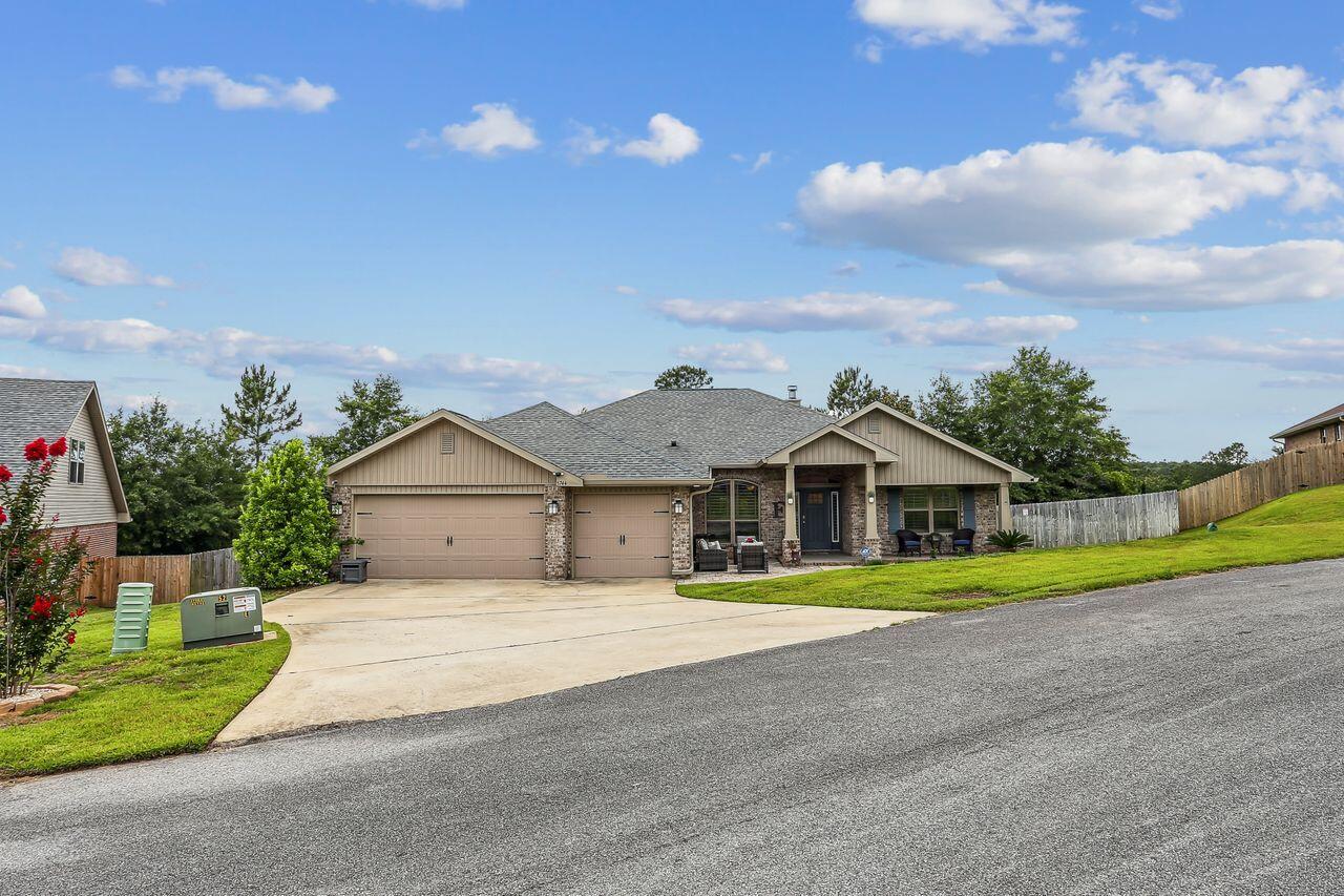Welcome to this craftsman beauty in North Crestview! This adorable 4 bedroom 3 bathroom home has it all including a 3 car garage! Desirable split floorplan! Stainless steel appliances! Formal dining room and office/flex room! You can see the pride of ownership built into every details of this easy living home! Durable epoxy floor coat on front and back covered patios! Elegant pavers added to extend front patio! Big bonus is the storage shed with power and AC! The master bedroom suite is spacious with an ensuite bathroom including separate vanities, garden tub, and separate shower! extra bonus neighborhood has refreshing pool to cool down and enjoy on those summer evenings and weekends!
