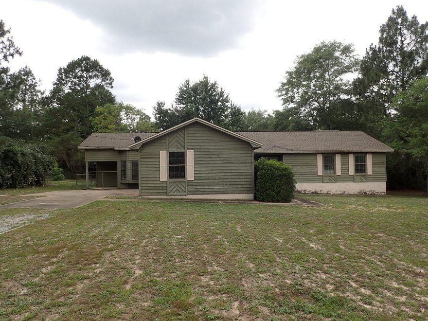 This Fannie Mae Homepath REO property is located just mins from the heart of Crestview! Resting on just over 1.1 acres, this large home has 4 bedrooms, 3 baths and a large fireplace in the living room area. Home has lap siding exterior, dimensional roof and fenced back yard. There is a separate storage building located on this homesite as well. Inside, you will find 2 master suites, one with private exterior exit. Kitchen is smaller but accommodating and laundry room is located inside the home. Home will not qualify for all financing but has tons of potential!! Call today!