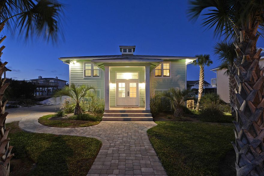 The pinnacle of waterfront living with 90' of canal frontage situated on a large, -1/4 acre lot on exclusive Holiday Isle, just 2 blocks to the deeded beach access! The property was completely re-designed between 2014 & 2015 and includes new floorplan, plumbing, appliances, flooring, electrical, roof, doors & windows, siding, HVAC & the addition of the large heated swimming pool with outdoor surround sound & dazzling lights! This is the perfect family vacation home or permanent residence for the homeowner that wants to feel like they are on vacation every day! Both levels of this spacious home have large living rooms with beautiful views of the Canal as well as full kitchens with dining tables & 2 full sized laundry rooms!