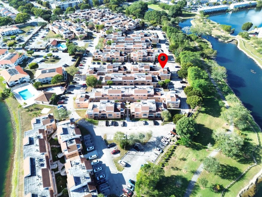 SPACIOUS AND COZY corner unit featuring 3 bed and 2 bath in the desirable Seasons Villas Community, centrally located in Kendall. This bright corner residence offers 1,220 sq. ft. of comfortable living space with open, spacious living areas and great natural light. Community amenities include a pool, playground, and clubhouse. Maintenance fees cover water, sewer, trash, roof, and exterior maintenance, offering added convenience and value. Enjoy an excellent central location near major highways, shopping, schools, hospitals, and golf courses. The unit includes assigned parking plus a second space with guest parking decal. Ideal for owner-occupants or buyers seeking rental flexibility with no rental restrictions. Pet-friendly and move-in ready!