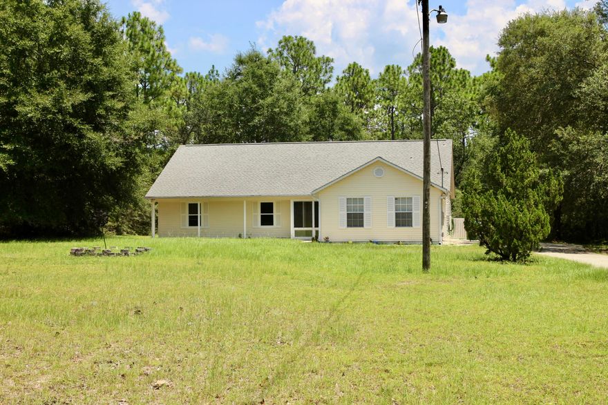 Photos coming soon. New roof to be installed with an acceptable offer. This 3 bedrooms 2 and ½ bath with a large enclosed Florida room overlooking a wooded backyard is waiting for a new owner. The kitchen has plenty of space for storage and has a large pantry leading into a dining area and a large great room, the Florida room is off the living room and the front has a screened porch. Freshly painted interior. This home offers peace and quiet with the acreage. Schedule your tour today.