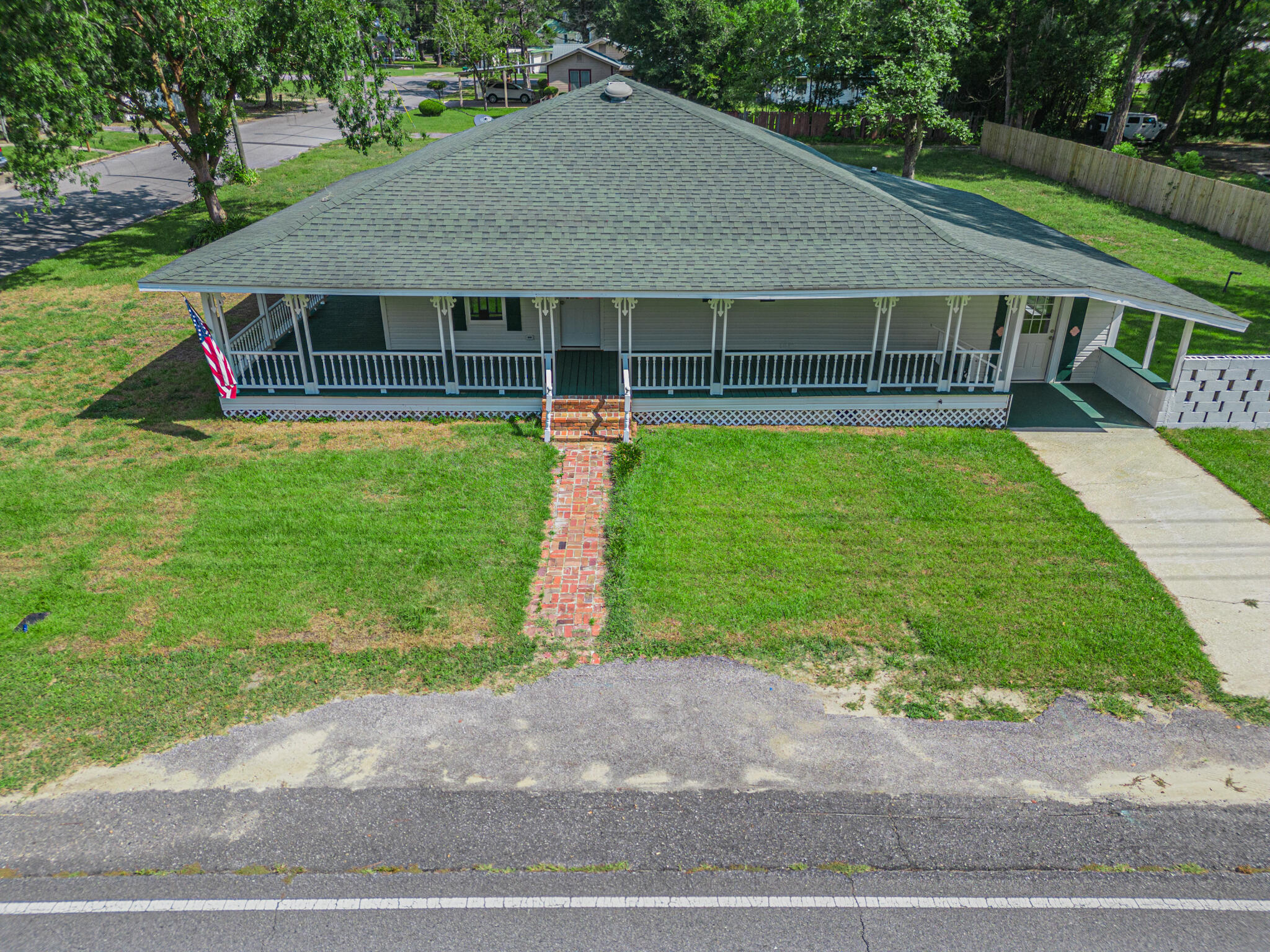 The wrap around porches-you can enjoy sitting and rocking for hours! A quaint floor plan provides you w/updated features yet, still embodies the true character of a timeless southern home. A 70 X 100 corner lot offers an easy walk to Lake DeFuniak and the downtown area. Completely renovated interior makes this home ready for occupancy. Enter into the open concept living area and kitchen/dining. The master bdr has a large window overlooking the backyard and has an adjoining mbath.Another bedroom has use of the second bath. The flex/pantry located beside the kitchen leads down to a large laundry and another storage area w/access out to the side yard. The yard has a new privacy fence on one side. Utilities include city water, sewer and fully electric.