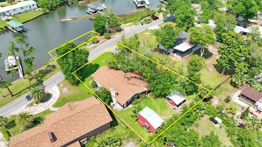 OPEN HOUSE - Friday June 20th from 1 until 4PM. WATERFRONT! COVE! Bayou front Living in the Historic Cove - 1206 Tyndall Drive Welcome to 1206 Tyndall Drive, a truly special property located in one of Panama City's most treasured neighborhoods, The Cove. This spacious 4-bedroom, 2.5-bath home offers over 2,200 square feet of comfortable, functional living space set on deep water frontage on Watson Bayou. Inside, you'll find an open and inviting layout featuring a formal dining room, an open-concept kitchen and family room, and a wood-burning fireplace for cozy evenings. Downstairs, the walk-out basement provides the perfect home office, homeschool, or flex space with tons of extra storage. Step outside to your private backyard retreat with a covered patio, privacy fencing, and mature  landscaping. You'll also find a detached workshop/she-shed and a second outbuilding for storage or hobbies. A whole-house generator ensures comfort and security no matter the season. But it's the lifestyle that truly sets this home apart. From your private waterfront access, hop in your boat and head to Shell Island for a day in paradise or enjoy waterfront dining in St. Andrews just minutes away. Plus, you're just blocks from the best of Downtown Panama City  boutique shops, cozy coffee spots, fresh seafood markets, restaurants, a sporting goods store, and scenic Beach Drive sunsets. The area is golf cart-friendly, with new sidewalks and roads enhancing walkability and charm. There's something special about The Cove and none more special than 1206 Tyndall Drive. Waterfront, flexible space, unbeatable location, and a price that's nearly unheard of for this lifestyle. Come visit today!