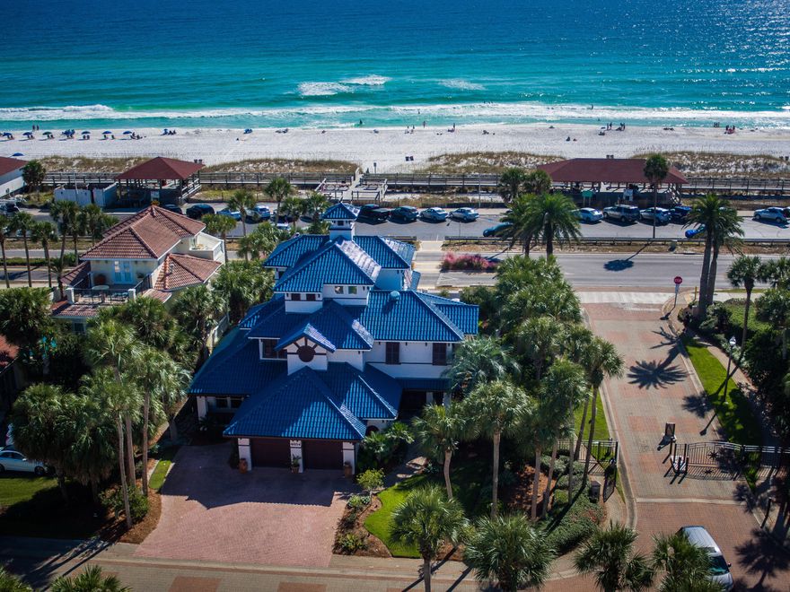 Destin's most architecturally iconic beach home boasts 180 breathtaking degrees of unobstructed gulf views. 4654 Destiny Way's striking Ludiwici Italian tile roof, deep shaded balconies, and lush tropical foliage are as memorable as the aquamarine waters visible from its walls of windows. Evans Architects of Orlando was awarded the Aurora Award for outstanding building design for their work on this home. Whether entertaining or relaxing, outdoor spaces are central to the home's design. The recently added saltwater heated pool and hot tub are a stunning addition to the beachside elevation. Deep, shaded, meandering balconies are the highlight of floors two and three for a total of 1971 sq. ft. in outdoor hardscapes, balconies, and porches. A covered porch warmly greets all who enter and then carries one away to sprawling outdoor entertainments spaces. Rich hardwoods meet cool tile for an eclectic blend of artistic style. Two first floor bedrooms enjoy gulf views while a third bedroom serves as a private suite complete with its own kitchen and separate entry. An elevator services all three floors. Get ready to be swept off your feet by mesmerizing second floor views through walls of glass. The second floor chef's kitchen and open concept living/dining don't miss an opportunity to highlight views of snowy white beaches and tantalizing aquamarine waters.  The recently renovated kitchen is modern in design and optimum in convenience. Sliding glass doors retract on two full walls, seamlessly blending indoor spaces and dreamy covered balconies. Retractable screens protect from the elements and provide shade from glaring sun. The second floor is completed by a master bedroom en suite with gulf views. Third floor living is currently used as a media room with its own full service bar and expansive balcony. With a private bath and closet, the third floor easily converts to a private bedroom. Destiny (West) is a private, gated community located in East Destin. Amenities include: Exercise Room; Fishing; Gated Community; Pavilion/Gazebo; Picnic Area; Playground; Pool; Tennis; TV Cable; Whirlpool.
