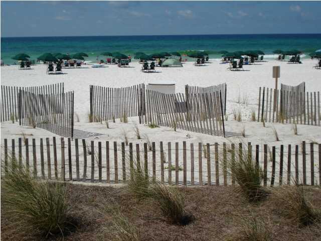 The best of Fort Walton Beach's resort offerings on 490' of spectacular beachfront. #B100 a large gr fl furnished with panoramic views 180 degrees of the beach/gulf. Unit is on the on-site rental program and a real performer with $65,522 in gross rents in 2012 and $61.400 in 2013; $67,213 in 2014 and $79,003 in 2015. WALK OUT 1,518 sf, premier southern most gulf front 3br/3.5ba w/bunks unit in Building B (west building)with large wraparound balcony facing the due south to the sugar white sand beaches and emerald green waters of the Gulf of Mexico. Sure to please, this is the only property with this level of amenities, large beach front, dune crossovers with 4 freshwater showers, 2 foot washing stations leading up to a spectacular split level courtyard with 2 pools and multiple deck