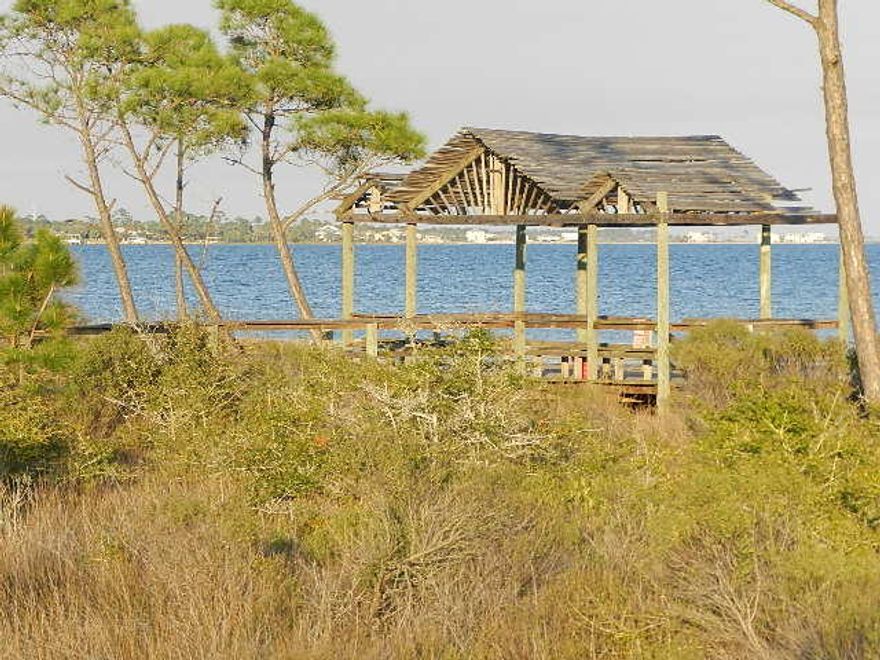 Biscayne Pointe subdivision is ideally located south of HWY 98 in east Navarre, situated on the Intra-coastal waterway just east of Navarre Bridge. It is an easy drive to the beaches and Hurlburt AFB. Neighborhood has a private recreational area with beautiful white sandy beaches and deeded water access to the Sound. Biscayne Pointe lot with easy access to the community beach on the Santa Rosa Sound. Close to beaches, and nearby bases. Drive by today and take a look!! Location is ideal for new construction and will little effort can the perfect home site with very little build-up.