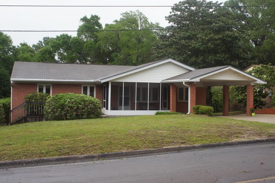 A Gold Star Property!! A rare find in Valparaiso Florida on a corner lot. Don't the age full you, Effective age of home do to updates is 1980! This brick home features a front screened porch, an open deck, a covered carport and extra parking. The home has vinyl windows with hurricane shutters for lower insurance rates. The original hardwood floors are still in great condition. The first bedroom has a custom Murphy bed for guests but also makes for a great office and the room has a closet. The two additional rooms are light and bright with two windows each, ceiling fans, hardwood floors, and closets. The guest bathroom has a deep cultured marble bath tub/shower, cultured marble vanity with great cabinet storage and tile flooring.