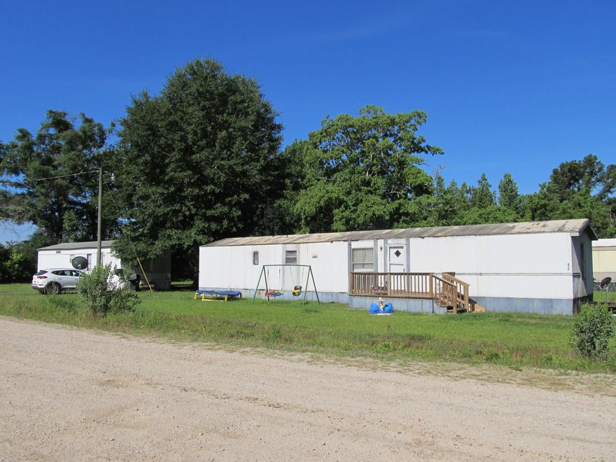 Investor Opportunity for small mobile home park with tenants in place located in Geneva, AL. All four singlewide manufactured homes will be sold AS IS/WHERE IS with property. Due to being occupied, please do not disturb tenants. Call or text your favorite agent for more information. All homes are income producing. Seller does not have knowledge of condition of homes nor additional information about the property. Buyer to perform all matters of due diligence - bedroom sizes and square footage are unknown by seller. Property is ready for next owner.