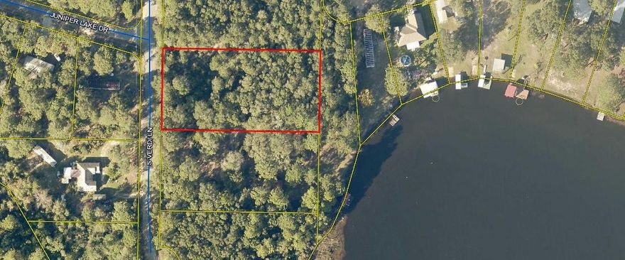 1 Acre wooded lot. Perfect place to build your dream home.  Property has a waterview of the Lake from the back of the property. Water and Electricity is available at road.