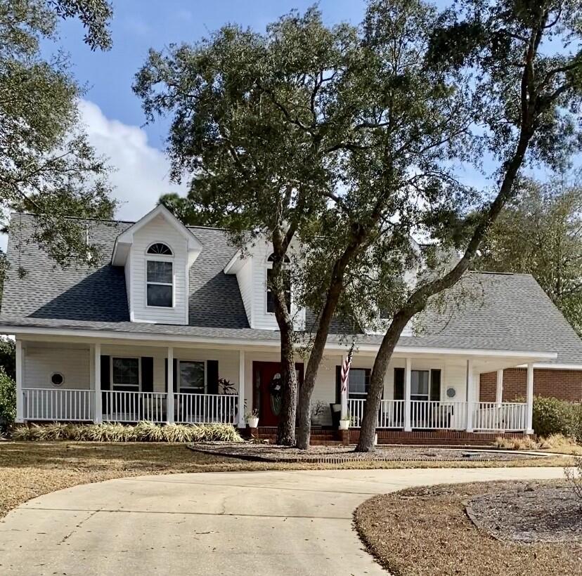 Southern porch style home on the golf course. Large 6 bedroom home, two stories, with granite countertops and stainless steel appliances. An open kitchen to living concept. Master on first floor.