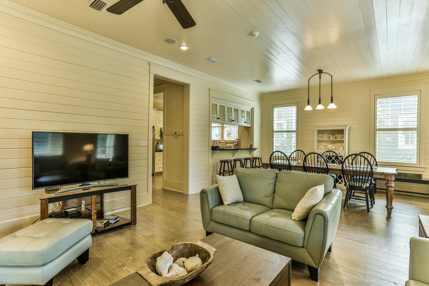 Come see your new Watercolor home today! Four bedrooms, 4.5 baths. Inviting Front porch welcomes you with rockers & porch swing;OPEN living room & dining room! Spacious Kitchen w/gas stove, new frig, microwave/convection oven; inviting breakfast bar; Hardwood Flooring just Refinished! Master BR on the Main floor! & a Guest BR on first floor w/private bathroom. Laundry Room & Powder Room.& private LARGE screened SIDE porch UPSTAIRS: 2 bedrooms w/new carpeting; & a media/bonus room; 2 bathrooms. Furnishings updated. Convenient Rear Parking.PLUS there is room on the lot to add a 2 car garage & carriage house & pool. Tranquil setting. Close to everything yet still secluded! Open & spacious floor plan awaits you & your family for a great beach property