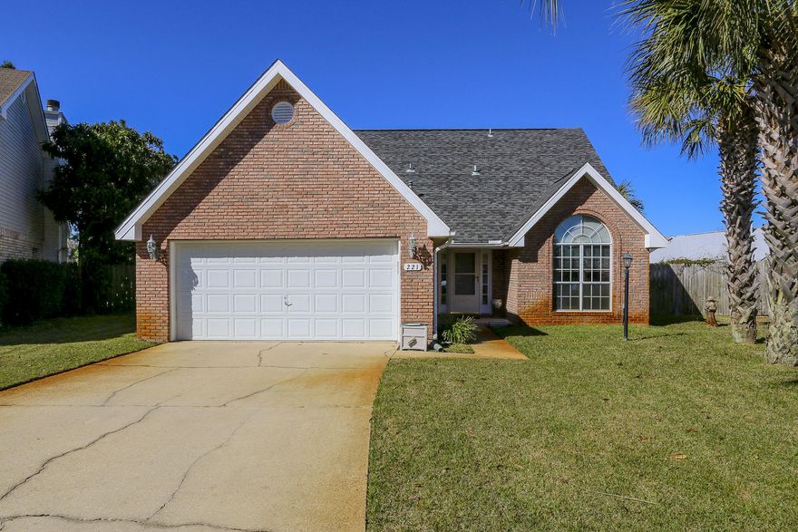 Nestled in the back of a quiet cul-de-sac in the middle of Destin is this lovely, meticulously maintained 4 bedroom brick home with a spacious back yard, large enough for a pool. Upon entering this lovely home, it opens to a soaring cathedral ceiling in the main living area providing a much larger feel to the room. Both the kitchen and master bedroom are conveniently located to the living area. In addition, a powder room is adjacent to the living area. A large deck leads to the back yard off of the eat-in kitchen offering a quaintness. For Video Tour, please click on Video tab under the Photos section of this listing. At the top of the stairs, you'll find an additional space which is open to the living area below (this could function as...