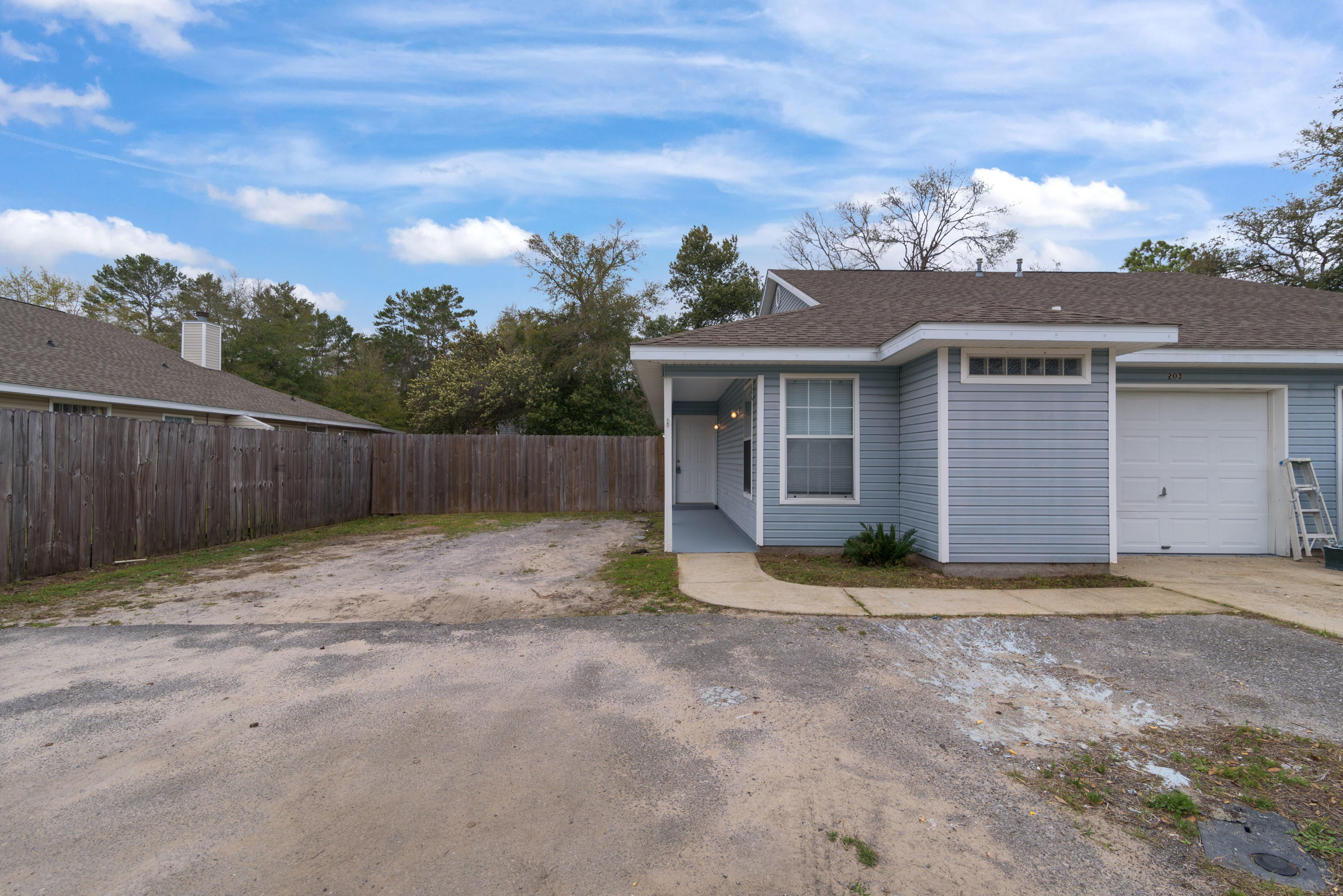 Excellent opportunity to own a 3 bedroom/ 2 full bath one story town home in Fort Walton Beach with side yard and Garage! Contemporary home with split bedroom plan and cozy gas fireplace. Recently painted, new carpet in all of the bedrooms. Tile flooring in kitchen/living/bath areas.Master bedroom has en suite bath. Newer roof, newer AC and newer water heater. Unit is adjacent to one other unit. Side yard is privacy fenced along one side. Two parking spaces plus single car attached garage provides parking for 3 vehicles. Convenient to Eglin and Hurlburt Air Force bases. Schools, shopping, restaurants nearby. White sandy beaches and Emerald Green water of Gulf of Mexico nearby!