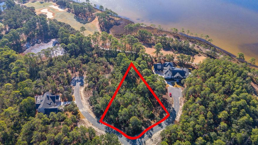 This is a large (.6 acre) homesite with potential water views is in the premier location of the community. Wild Heron is situated along the shores of Florida's largest coastal dune lake; under canopies of beautiful old oaks is a place of privacy and quiet comfort offering extravagant views of Lake Powell and the picturesque Shark's Tooth golf course. This unique Coastal Craftsman community, best described as a sanctuary, offers all the world-class amenities you could ever need including Shark's Tooth Golf Club, Har-Tru Hydrocourt Tennis Courts, a lakeside grill and fire pit, community swimming pool, fitness center, boardwalks, trails and parks. The Boathouse at Prospect Point includes a dock for access to Lake Powell and is well stocked with kayaks and canoes for residents' use. Wild Heron uniquely offers low density living; hard to come by in this area.  Gated community with full time guard shack.  Come and take a look for yourself!

Nearby:
5 mins to Publix or Winn Dixie
10 mins to 30A
12 mins to Rosemary Beach
20 mins to Pier Park