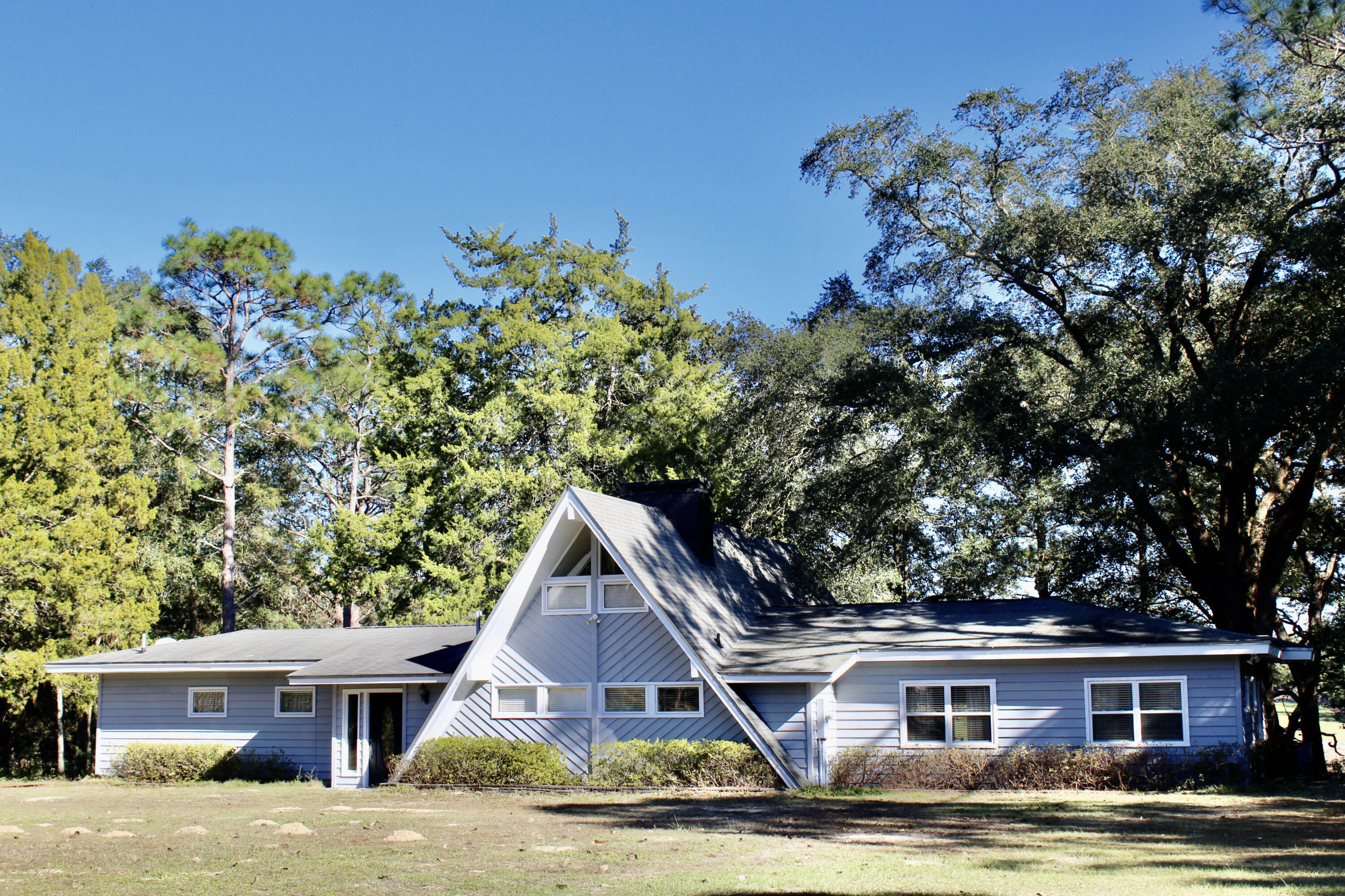 Quiet, Peaceful and Serene.    Located at the end of Pretty Pond Lane. This beautifully designed waterfront A frame overlooks Pretty Pond a natural spring fed 7-acre lake.  Lots of windows.  Plenty of sun. Almost every room has a beautiful view of Pretty Pond. Swim, fish and enjoy the peace and quiet of country living at its finest.   Great location.  Easy access to all amenities.  The house is wrapped in custom cut 1.25-inch-thick cedar siding.   The home was remodeled in 2007 & 2008, including new upgraded kitchen with granite counter tops.   A/c units replaced in 2016 & 2018. Bathrooms upgraded.   New paint throughout, new wrap around deck installed in 2020.  24x24 workshop.   This one-of-a-kind waterfront hideaway is move in ready.  Cash or conventional l by appt. 24 hrs notice