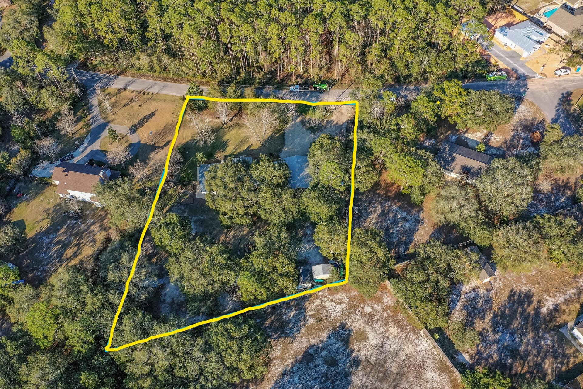LIKE NEW HOME w/NEW METAL ROOF ON 1.1 ACRE & CLOSE TO EVERYTHING! Are you ready to exhale? To finally have a giant, private, park like back yard where you can relax & feel completely at ease. To have a 1200 SF, 12 ft high, metal exterior enclosure to house 6 vehicles & all your ''stuff''. Want a gorgeous Home w/open floor plan, high ceilings, stunning kitchen, updated bathrooms, 2 living areas & brand NEW metal roof? You've found it. This 1-of-a-kind home is the full package. The new Kitchen, w/top of the line Quartzite counters,GAS stove & huge island, takes center stage & flows effortlessly into dining & living area w/fireplace. The giant 290 SF Great rm w/12 ft ceiling, added in 2014, will be the gathering place for all. Other features include NEW: LVP & tile wood look flooring,
