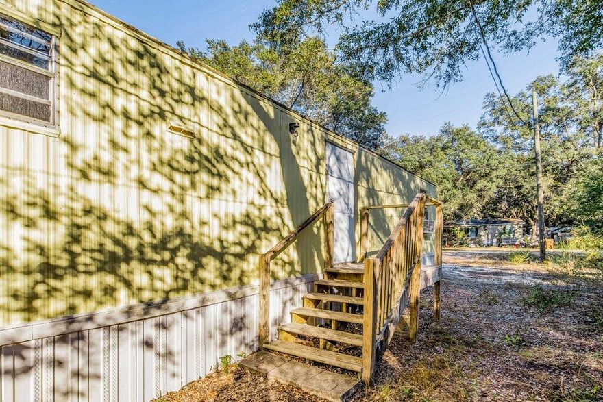 Conveniently located just 3 miles from downtown Milton, this home sits on a quarter acre lot. Enjoy the privacy of being nestled among the trees. The entire exterior as well as each space inside have been recently repainted and are ready to welcome you home. just 6 minutes to I-10 access. Check out our full video tour on MLS and YouTube.