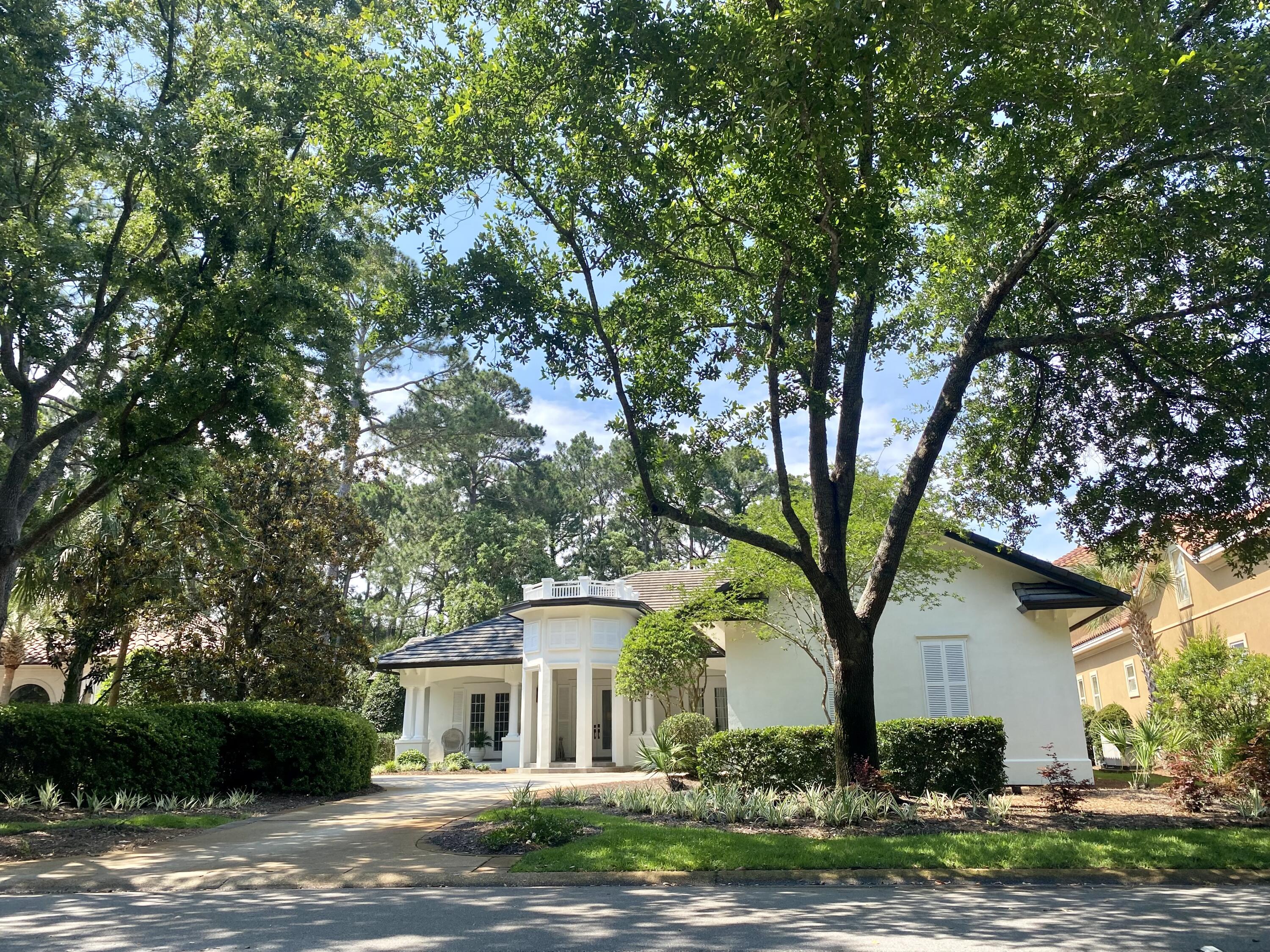 Nestled on a quiet cul-de-sac in Burnt Pine, this grand single-story residence boasts 12 foot ceilings, hardwood floors and stunning architectural doors and windows. A gas fireplace provides a cozy focal point for the living room which overlooks the peaceful lush lanai and fenced-in pool area. The heart of this home is undoubtedly the French chef's kitchen, meticulously designed with beautiful thick beveled marble countertops. A large butler's pantry with coffee station, built in refrigerator and wine cooler are just a few of its other numerous features. The spacious master suite contains his and her walk in closets. Wall to wall marble adorns the bath which also features a copper tub and massive shower with multiple shower heads. Too many features to list, schedule a showing today!