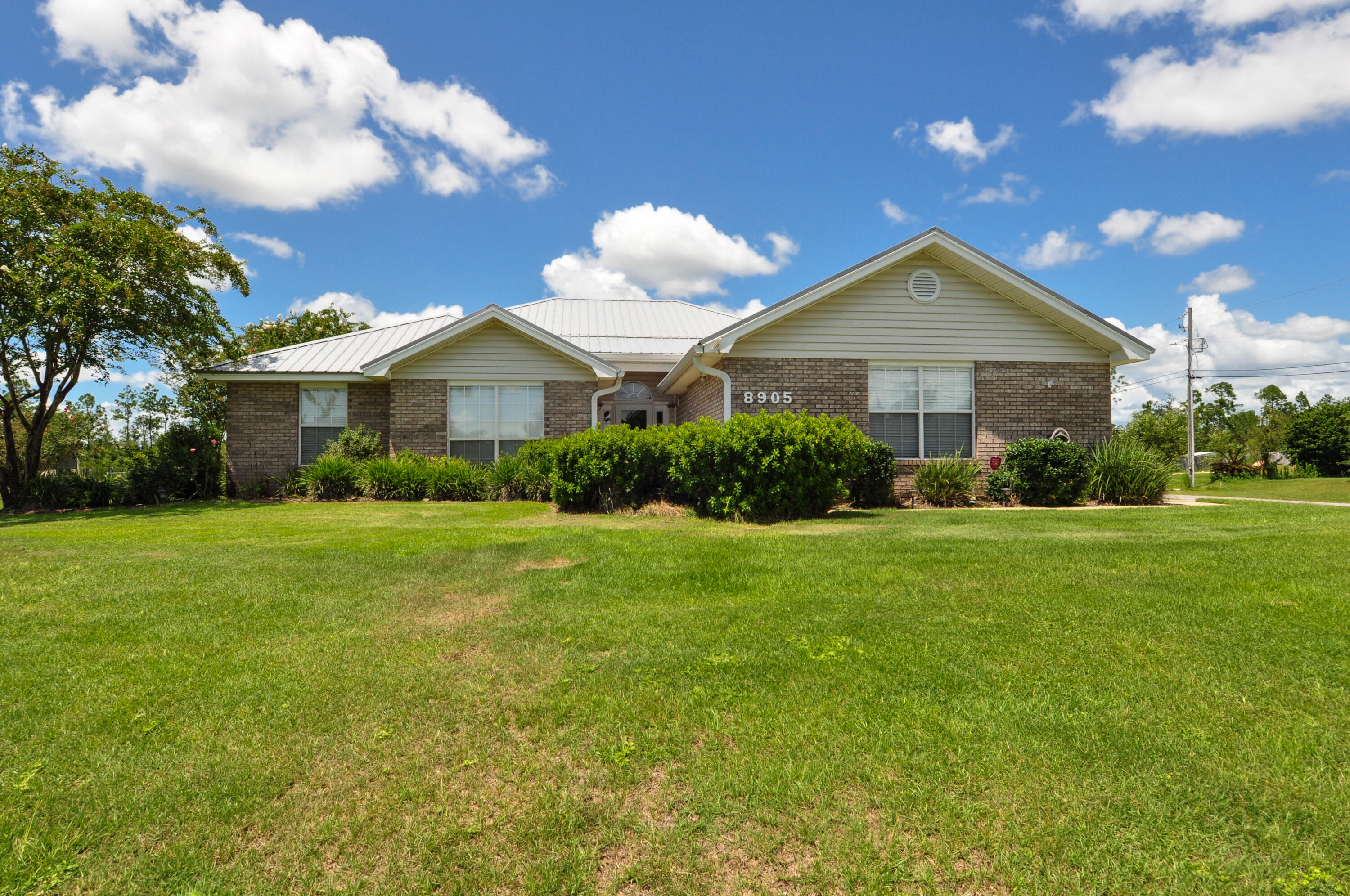 Move-in ready 4BR/2BA home on a half-acre corner lot in Indian Creek Village, 1/4 mile from boat launch at Deerpoint Lake! This home got a new roof in 2019 & the kitchen has been updated with Granitecrete countertops and stainless steel appliances. Living room features a cathedral ceiling & fireplace, the master bedroom has a walk-in closet & the adjoining bath boasts a double-sink vanity & custom tiled shower. There is a screened porch off the back of the home overlooking a privacy fenced yard & the lawn is lush & green with a paver patio ideal for dining al fresco. Got toys? You'll love the 20x20 workshop with electricity & the RV parking area has 30 amp service. The 2-car garage is side-loading and just a mere 10-12 minutes from town.